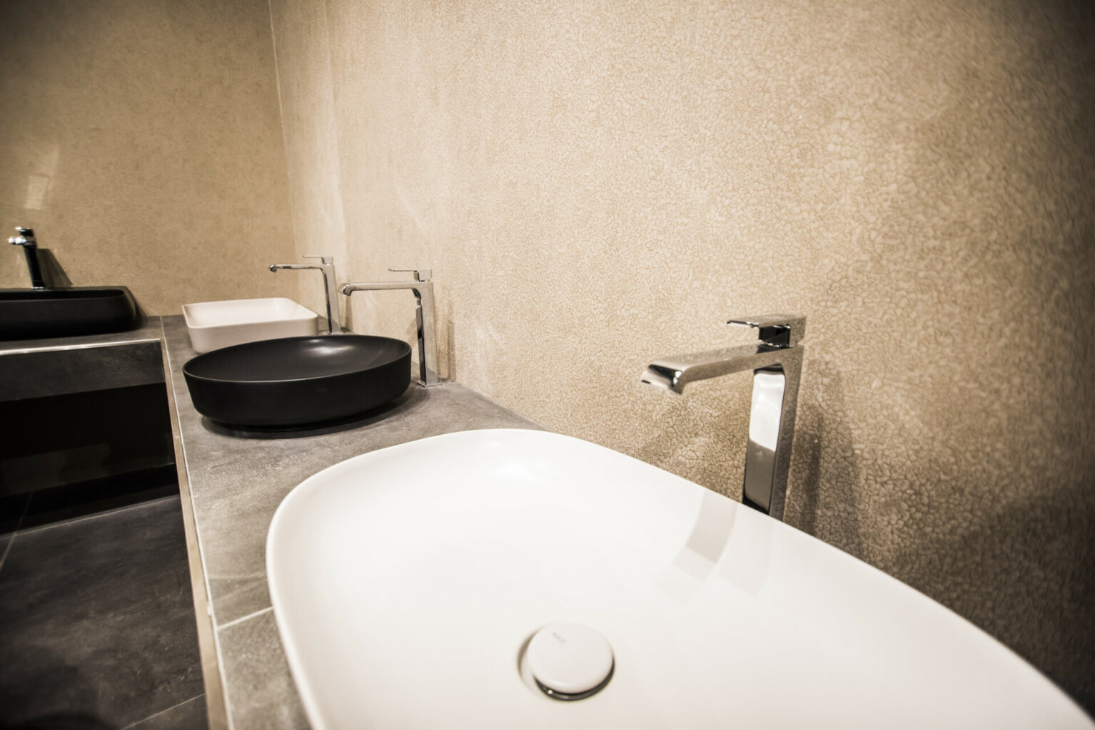 a sink and faucet in a bathroom