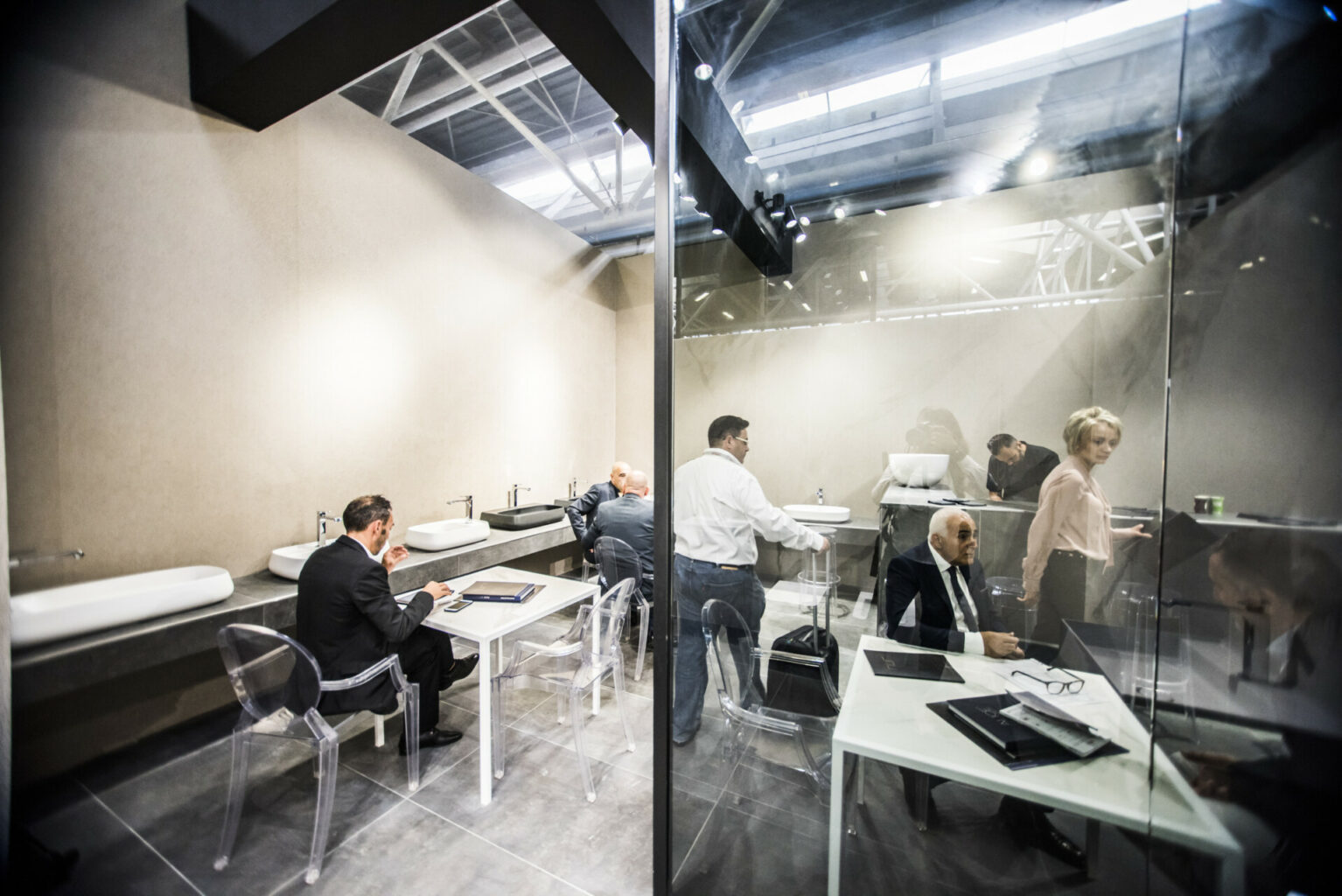 a group of people sitting at tables in a room