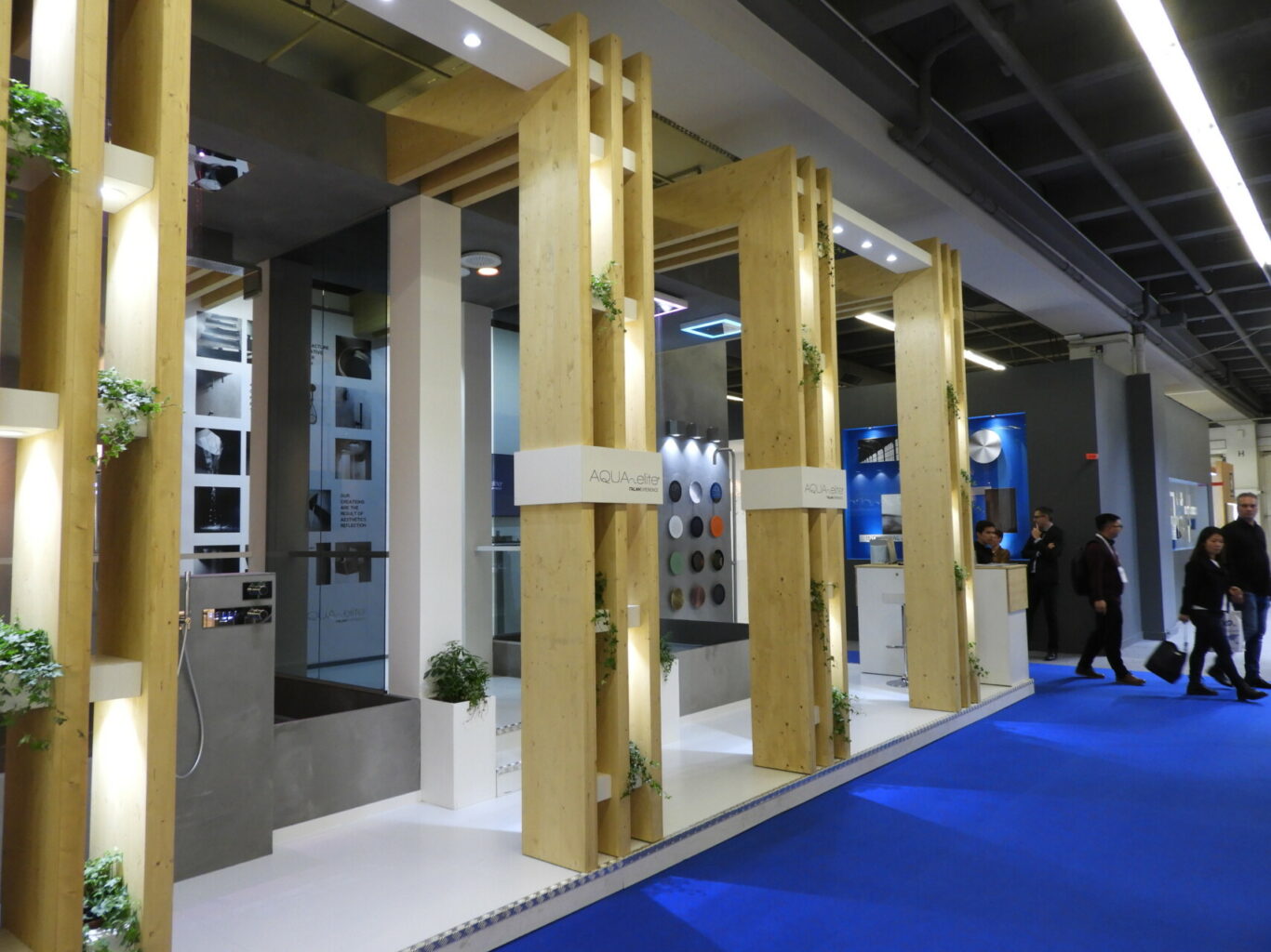 a display of wood pillars and blue carpet