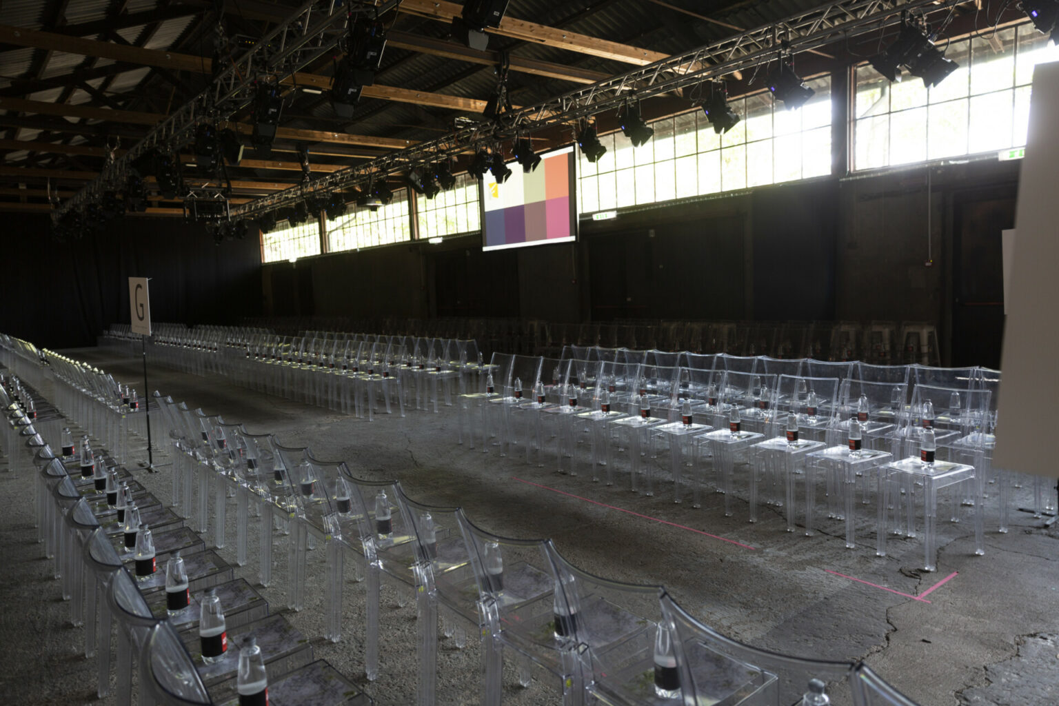 a group of clear chairs in a room