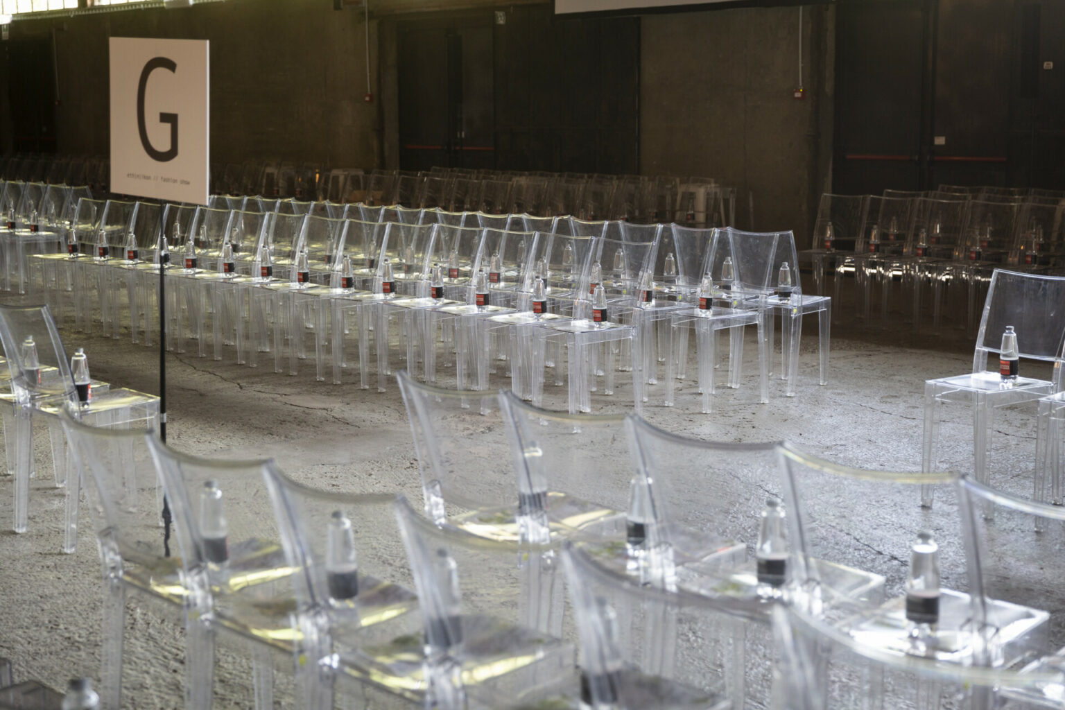 rows of clear plastic chairs