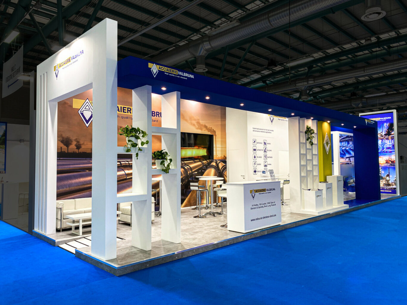 a white and blue booth with blue carpet