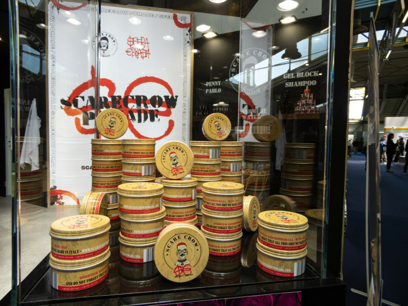 a display of round containers with red and white labels