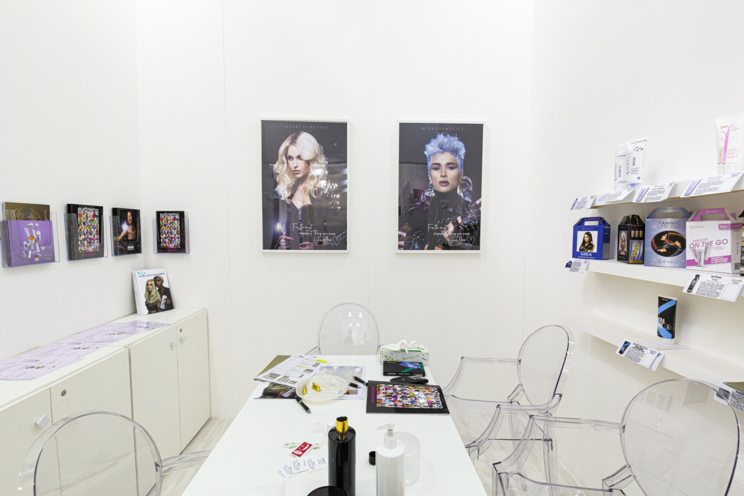 a room with a table and chairs and a picture of a woman on the wall