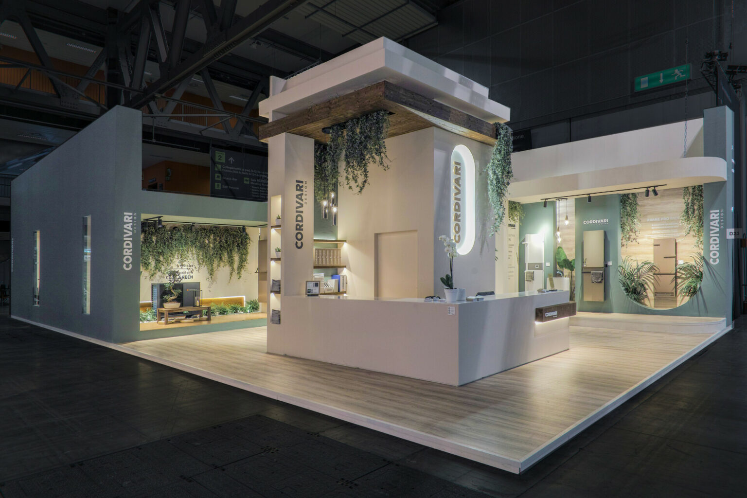 a white and wooden display with plants from the ceiling