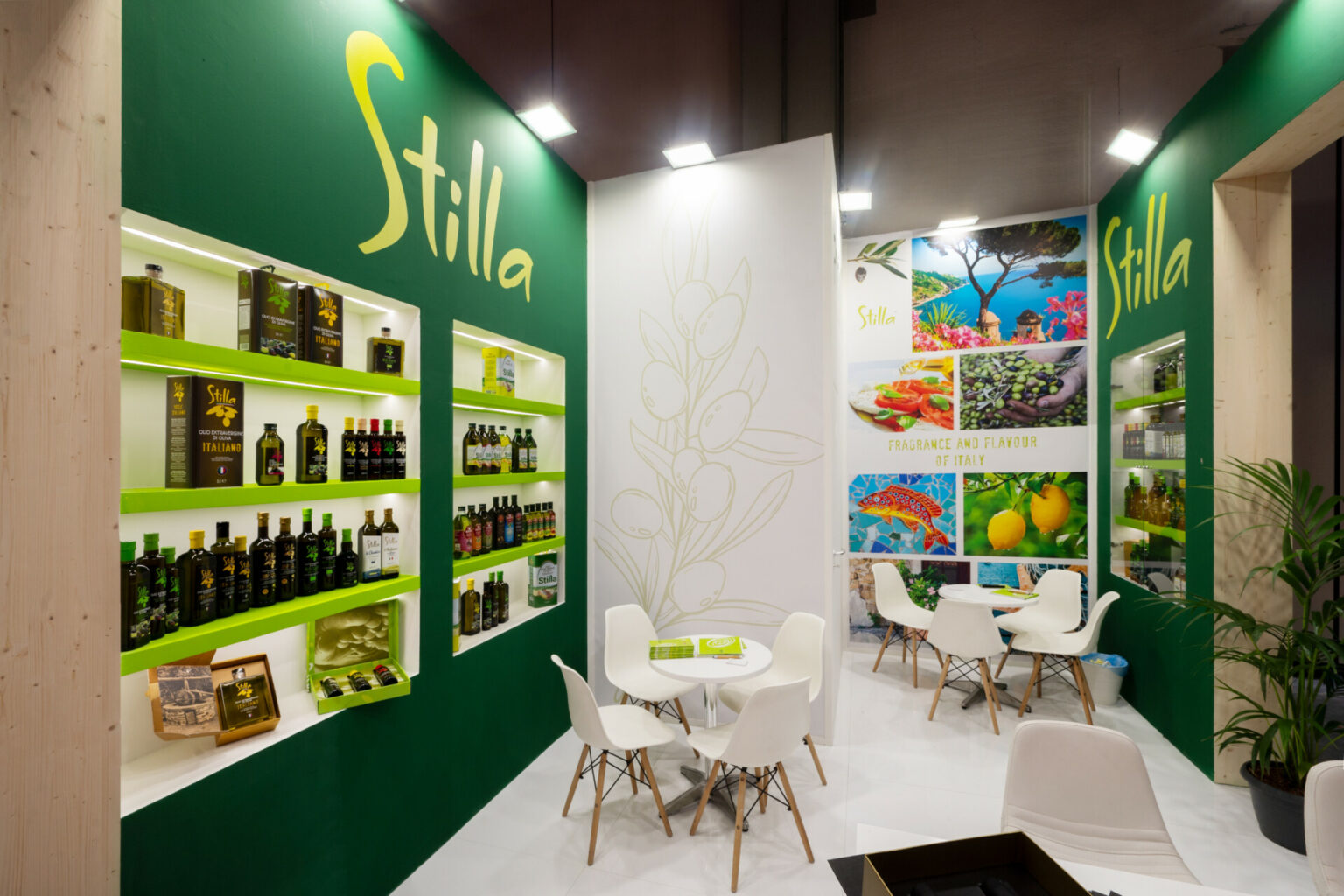 a room with a table and chairs and shelves with bottles of food