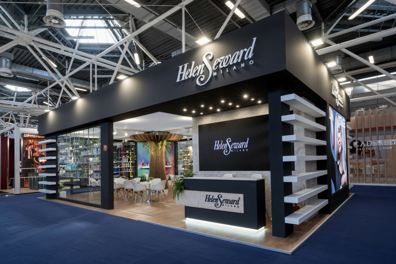 a black and white store with white shelves and a table