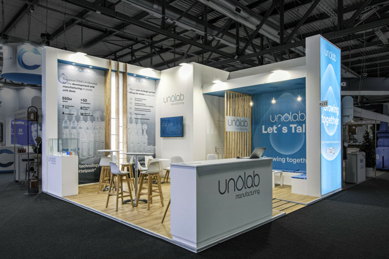 a white and blue booth with a table and chairs